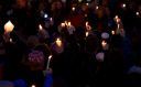 Members of the Squirrel Hill community hold up lit candles as they come together for a student-organized candle vigil in rememberance of those who died earlier in the day during a shooting at the Tree of Life Synagogue in the Squirrel Hill neighborhood of Pittsburgh