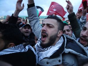 People waving Palestinian and Turkish flags gather in front of the Brandenburg Gate to protest against U.S. President Donald Trump’s announcement to recognize Jerusalem as the capital of Israel on December 8, 2017 in Berlin, Germany. Several thousand, mostly Muslim protesters attended the rally.