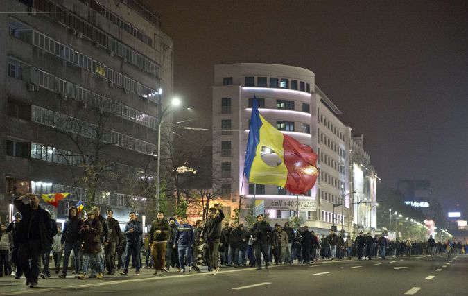 Romanian supporters of Conservative Klaus Iohannis march the streets