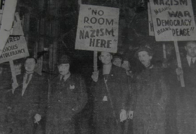 The Minutemen, a Jewish anti-Fascist group active in the 1930’s. The author’s cousin, Jake Rothseid, stands on the far left, holding a picket sign and a cigar.