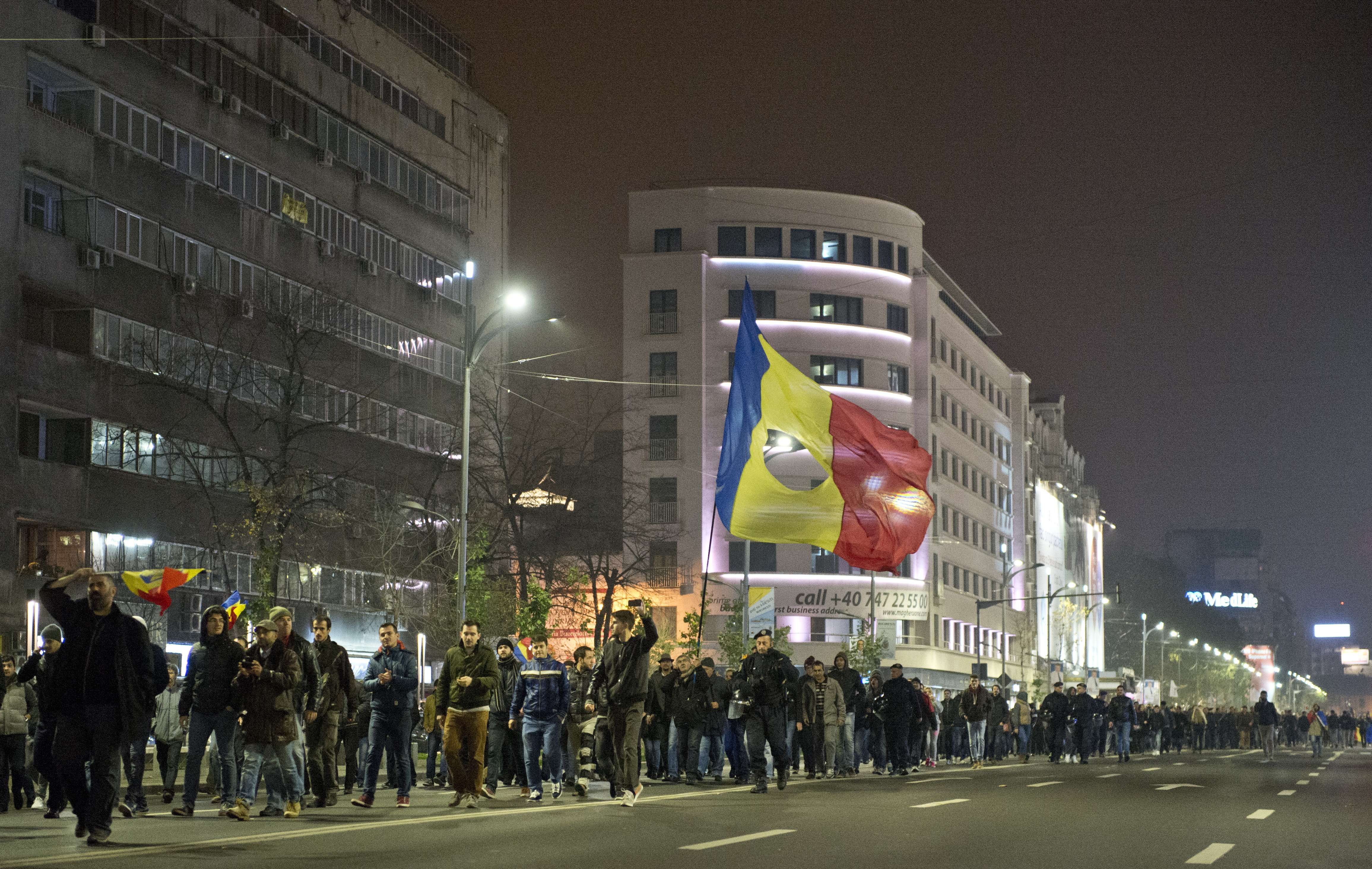 Romanian supporters of Conservative Klaus Iohannis march the streets